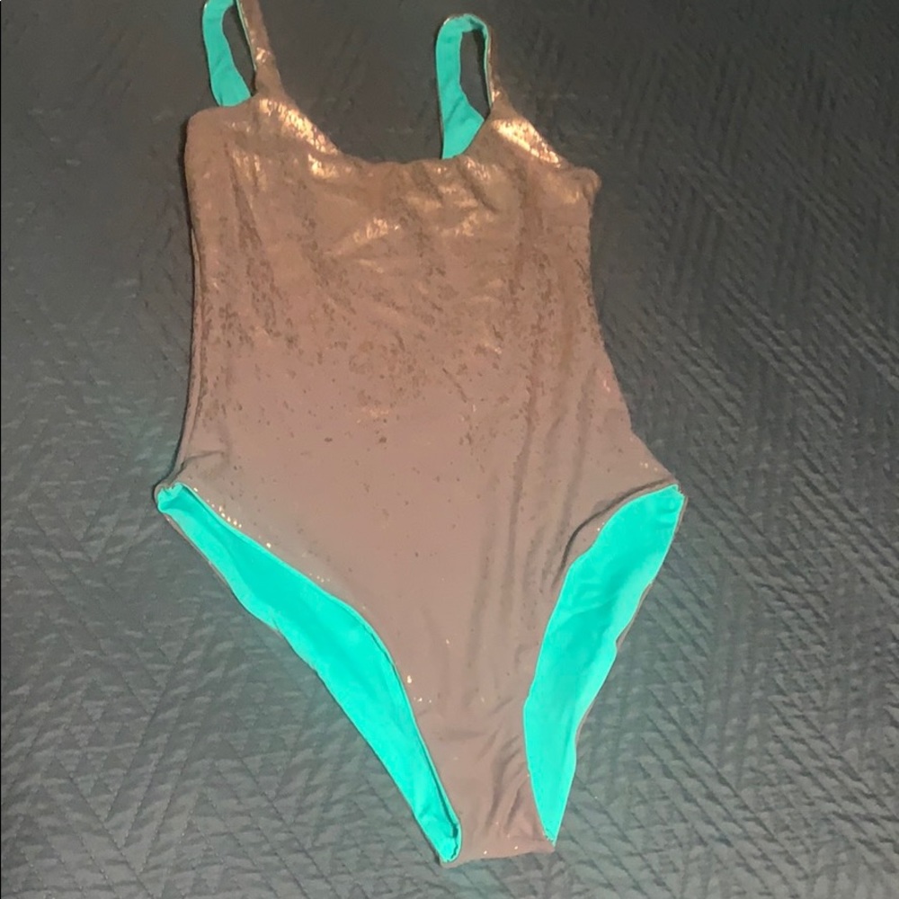 Never worn reversible one piece